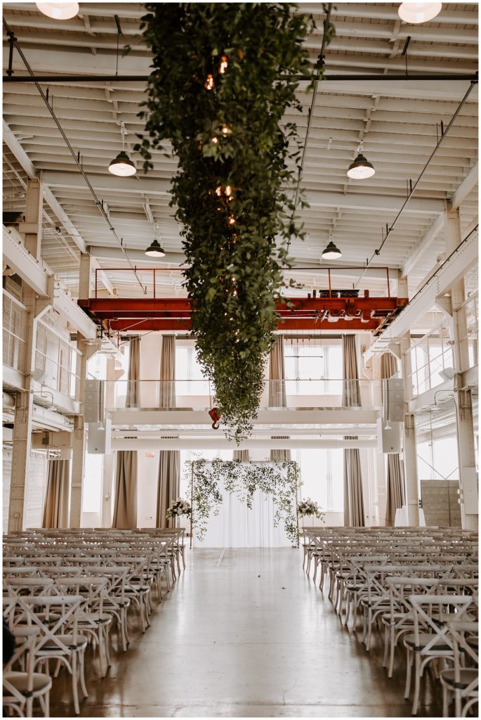 Machine Shop wedding decorated for ceremony