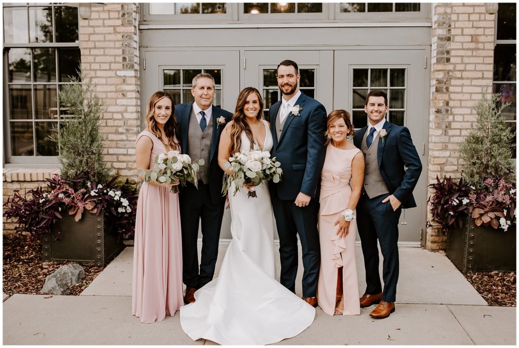 Bridal party on wedding day at machine shop